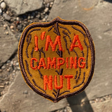 Vintage I'm A Camping Nut felt embroidery nut shaped patch. New old stock, unused retro style