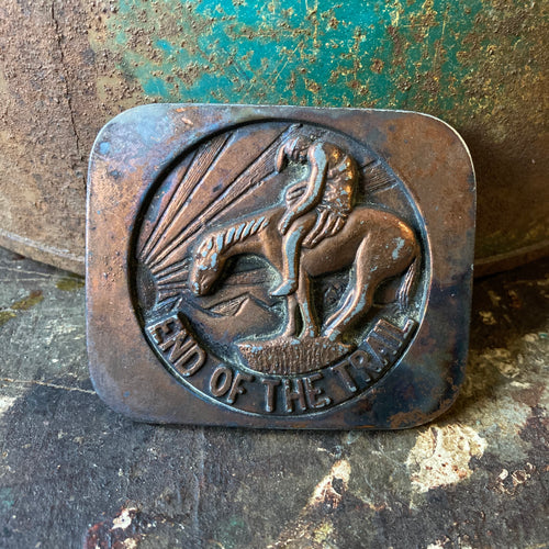 End of the Trail belt buckle